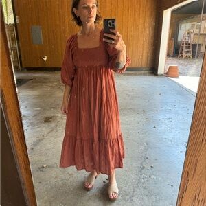Size M rust colored very feminine dress.